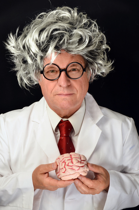 A "mad scientist" with crazy hair, holding a brain